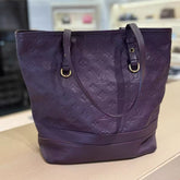 Louis Vuitton purple embossed tote bag