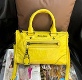 Miu Miu lemon yellow motorcycle-style shoulder bag